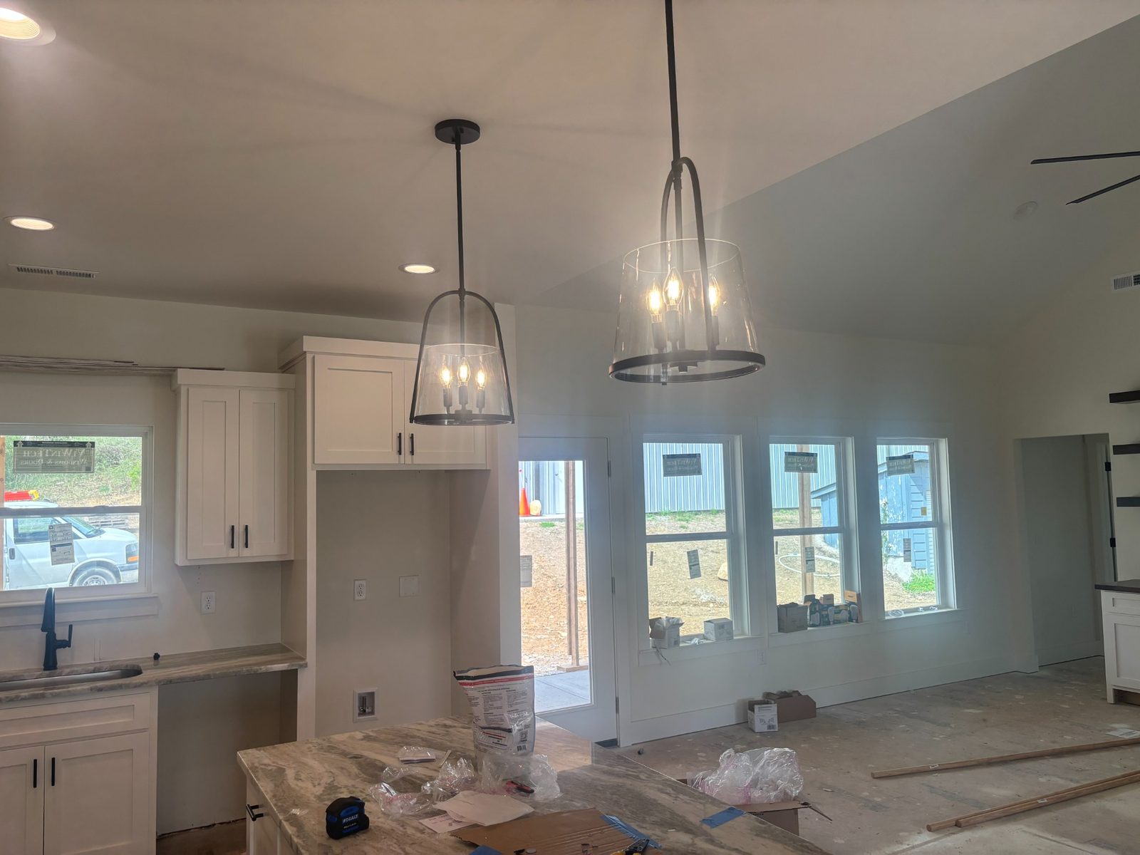 Kitchen pendant lighting installation in a residential home.